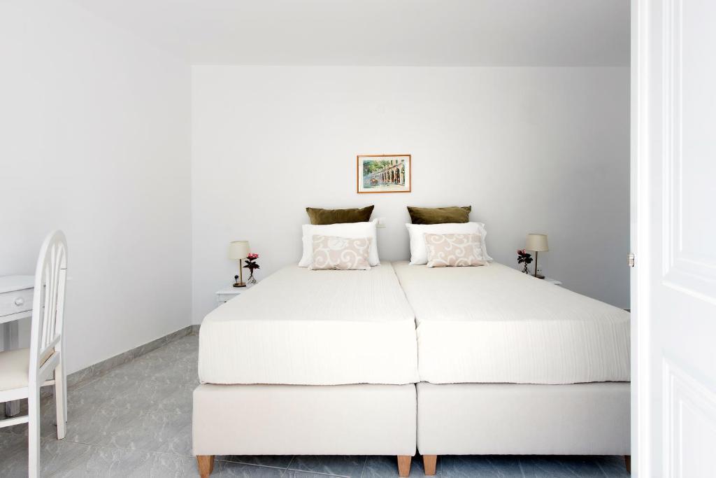 Postel nebo postele na pokoji v ubytování NiSea Apartments