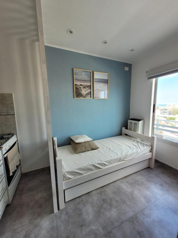 En eller flere senge i et værelse på Departamento Boutique del mar