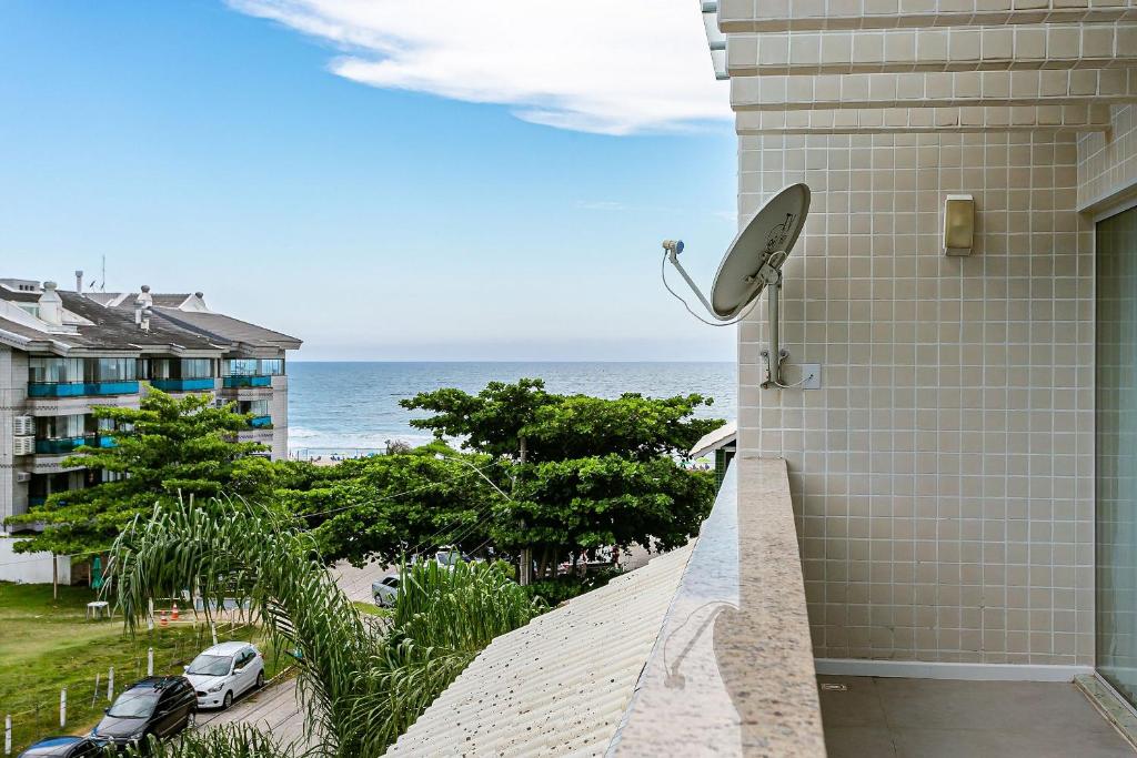 a view of the ocean from the balcony of a condo at Apto vista mar a poucos metros da P. Brava CTA022 in Florianópolis