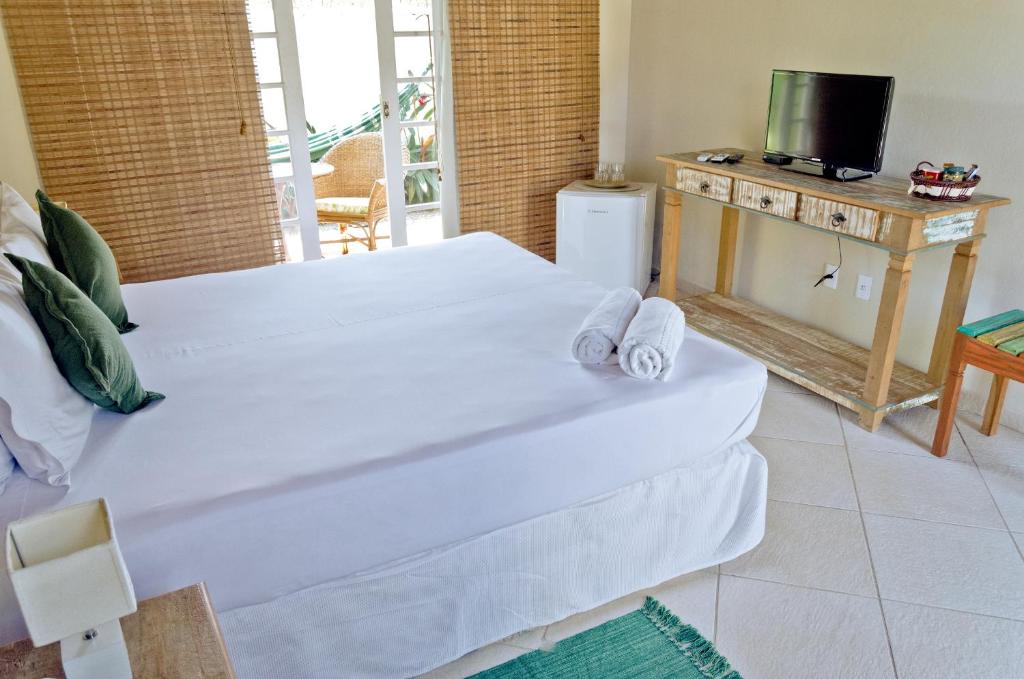 Postel nebo postele na pokoji v ubytování Quinta Brasilis Boutique Hotel Paraty