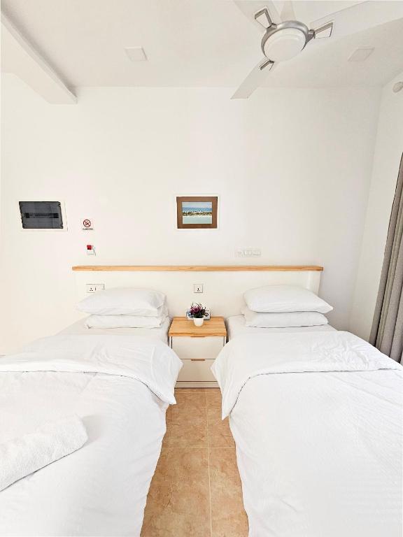 Postel nebo postele na pokoji v ubytování Keveli Guesthouse