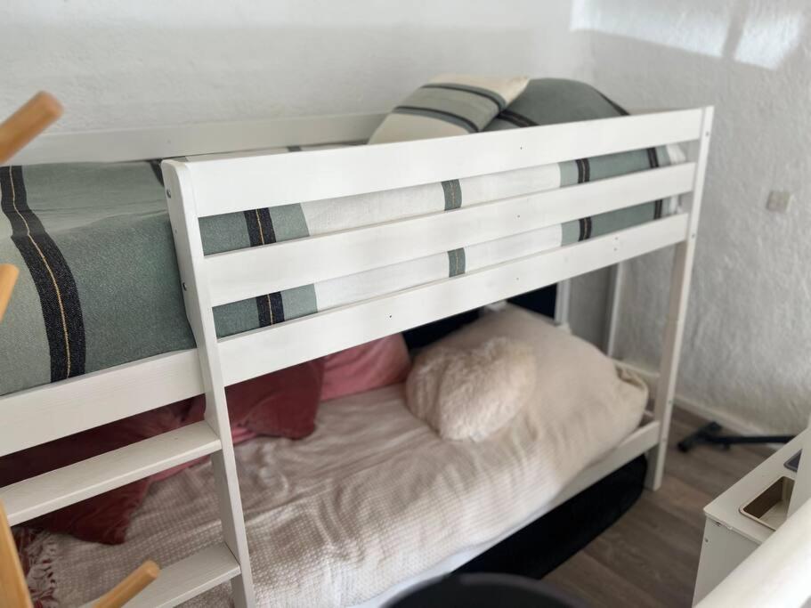 a white bunk bed in a room at Un été sans fin in Lauris