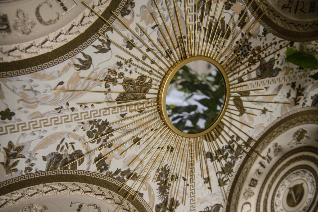 a mirror on the ceiling of a building at Luxury Versace 1 Bed Hot Tub Pool Table Sky Tv in London