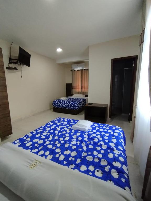 Postel nebo postele na pokoji v ubytování Hotel Villa