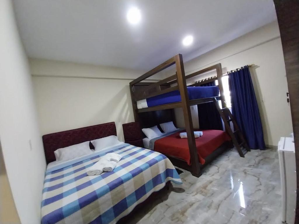 Postel nebo postele na pokoji v ubytování Hotel Villa