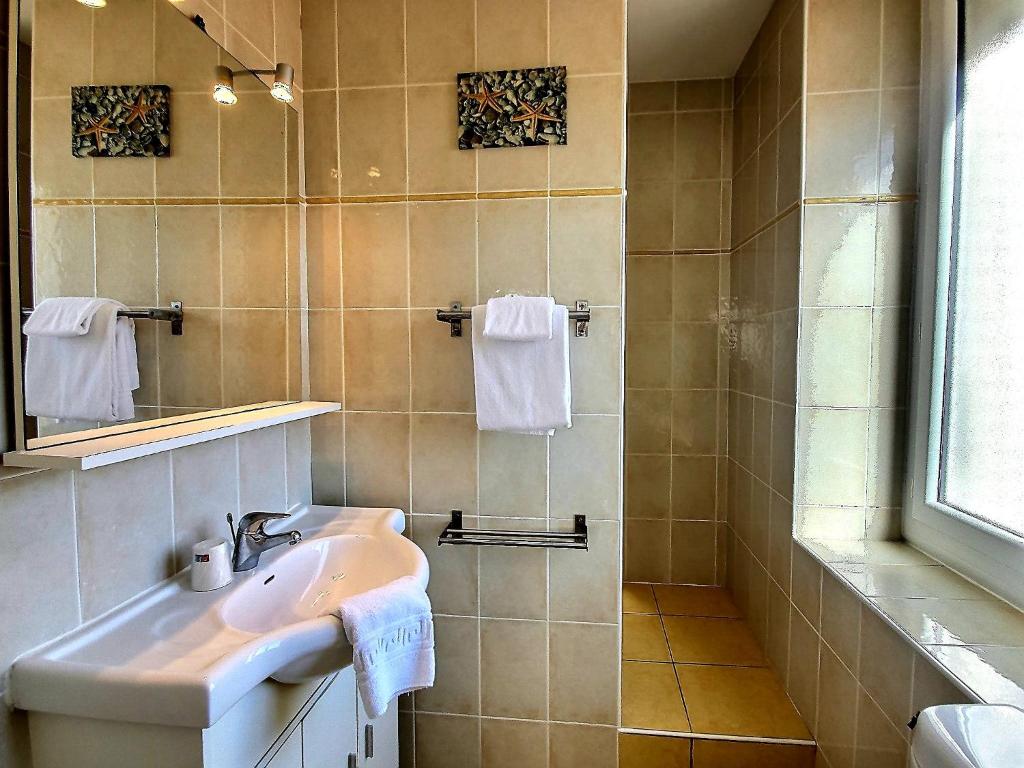 Koupelna v ubytování Atlantis Hôtel