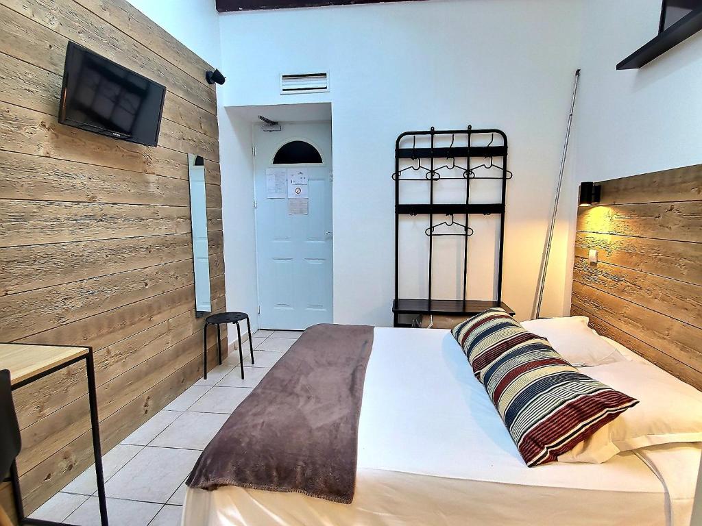 Postel nebo postele na pokoji v ubytování Atlantis Hôtel