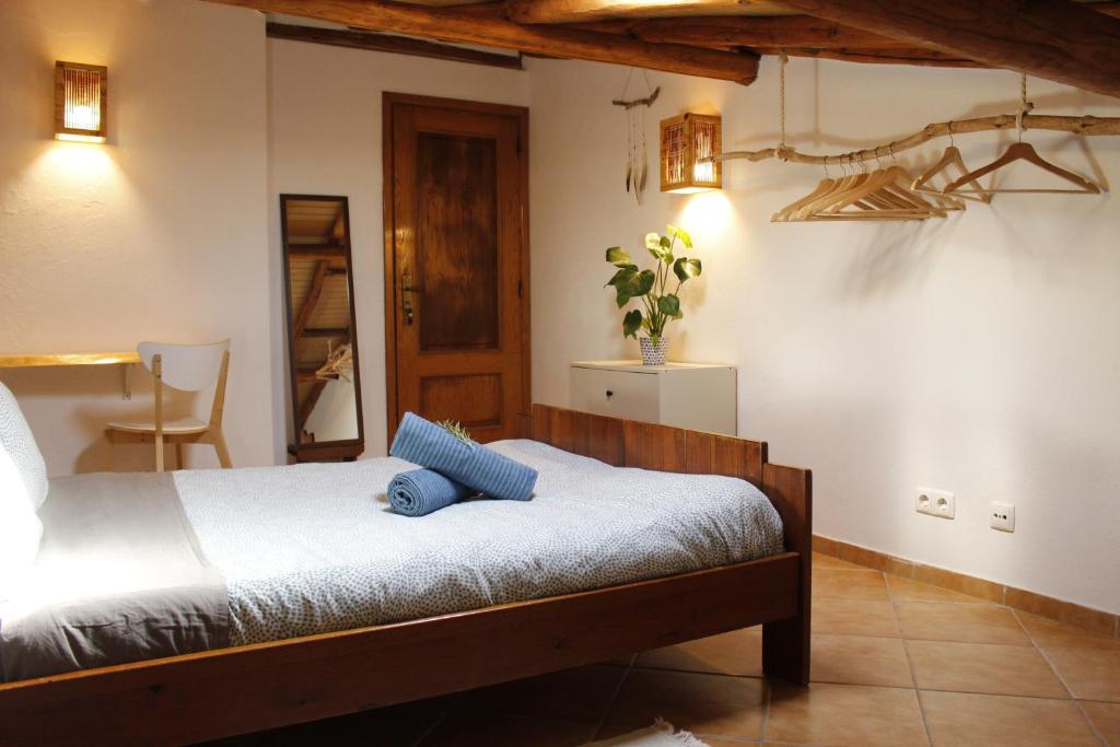 a bedroom with a bed in a room at Aldeia Caiçara Surf House in Sagres