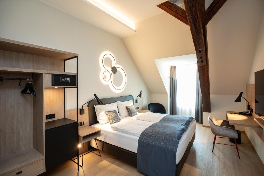 Posteľ alebo postele v izbe v ubytovaní Hotel Böhlerstern
