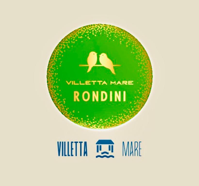 un cerchio verde con due uccelli sopra di Villetta le Rondini a Lignano Sabbiadoro