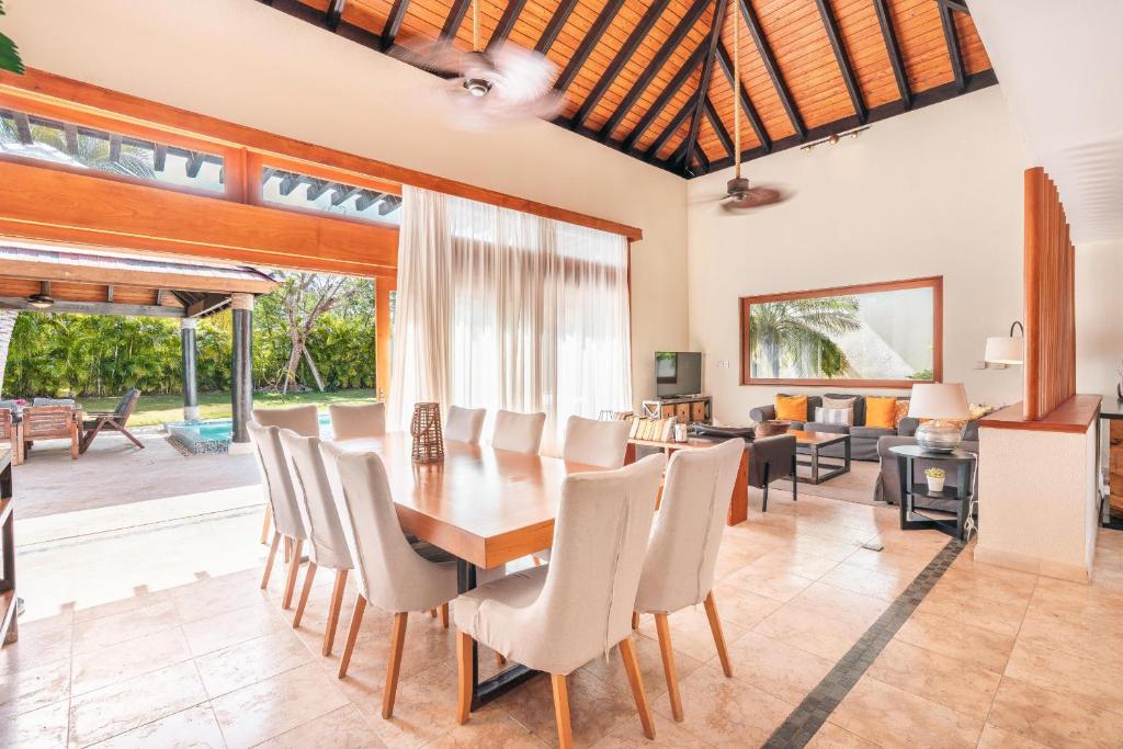 a dining room with a table and chairs at Amazing 5br villa w pool at Green Village A in Punta Cana