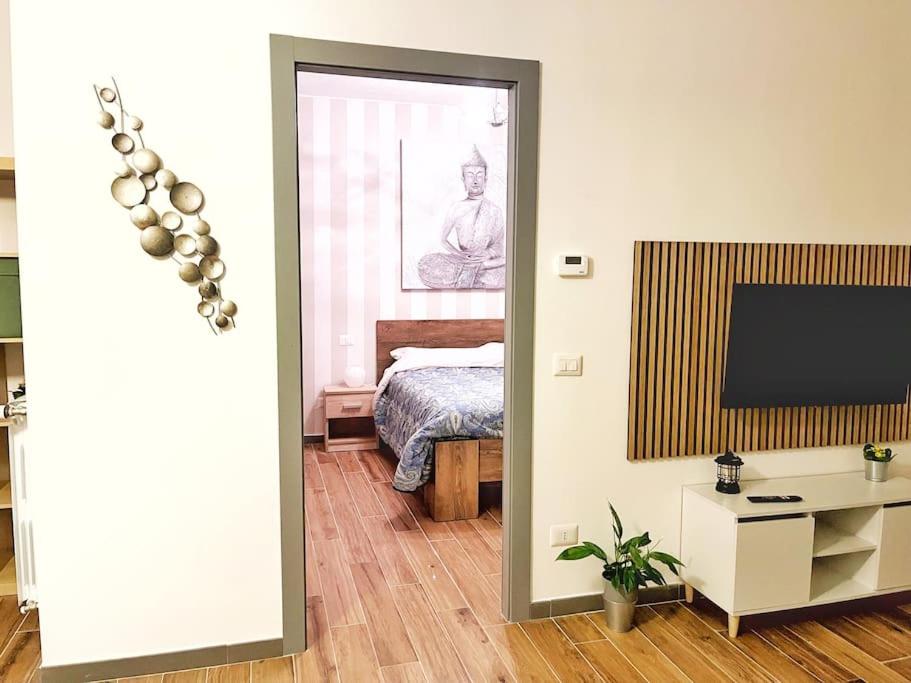 a room with a bedroom with a bed and a mirror at Brand New Panoramic Apartment in Vitinia