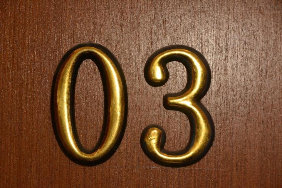 a close up of the number two in gold at Etno Kuca Paor-apartmani in Kikinda