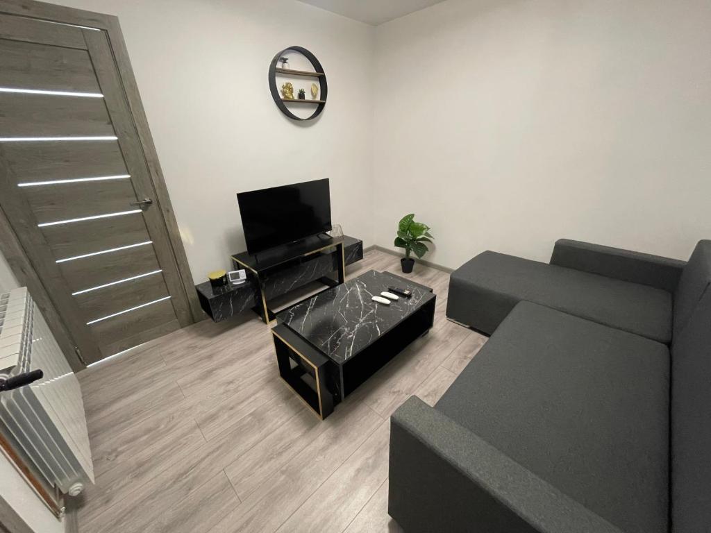 TV i/ili zabavni centar u objektu Apartament ultramodern central