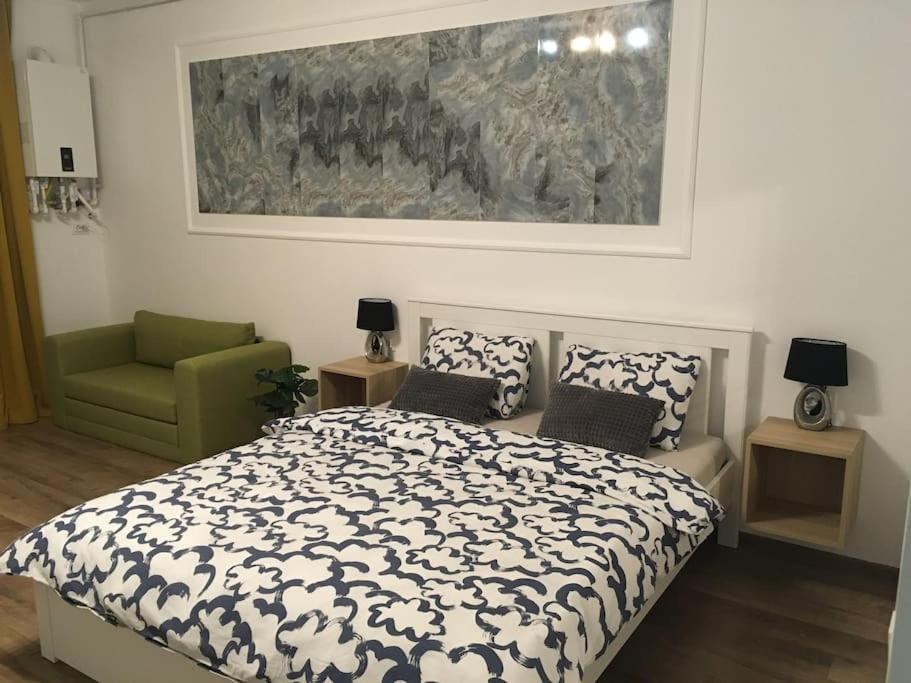 En eller flere senge i et værelse på Dbo-Vivo Mall Apartment