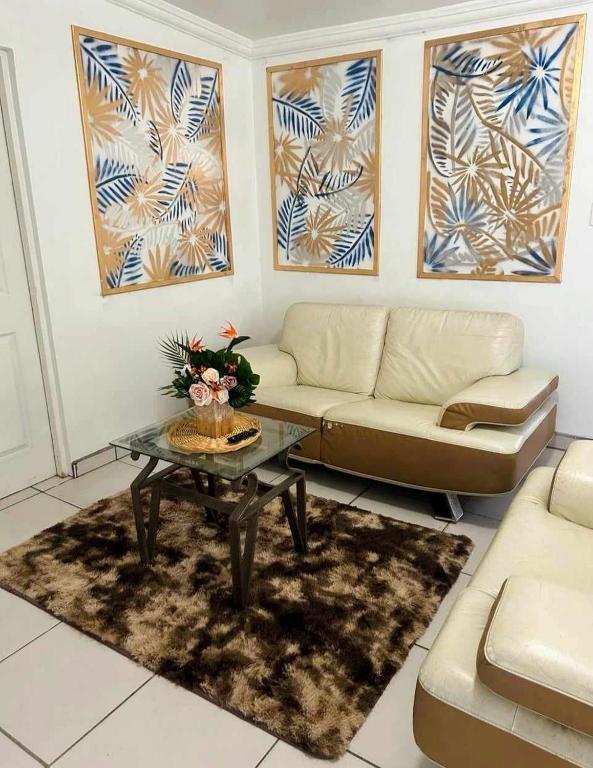 a living room with a couch and a coffee table at Casa Peninsula in San Felipe