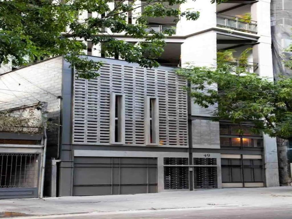 a building with a lot of windows on it at Roma Majestic By Mr W in Mexico City