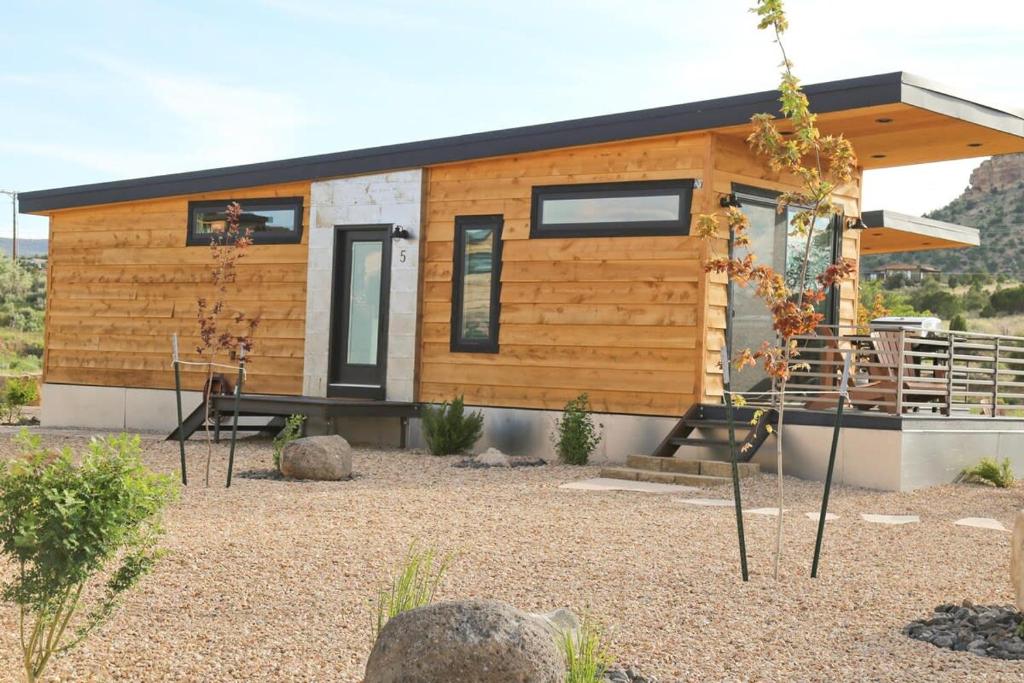 a tiny house in the middle of a yard at Escalante Escapes Prickly Pear- Bunk Escape in Escalante