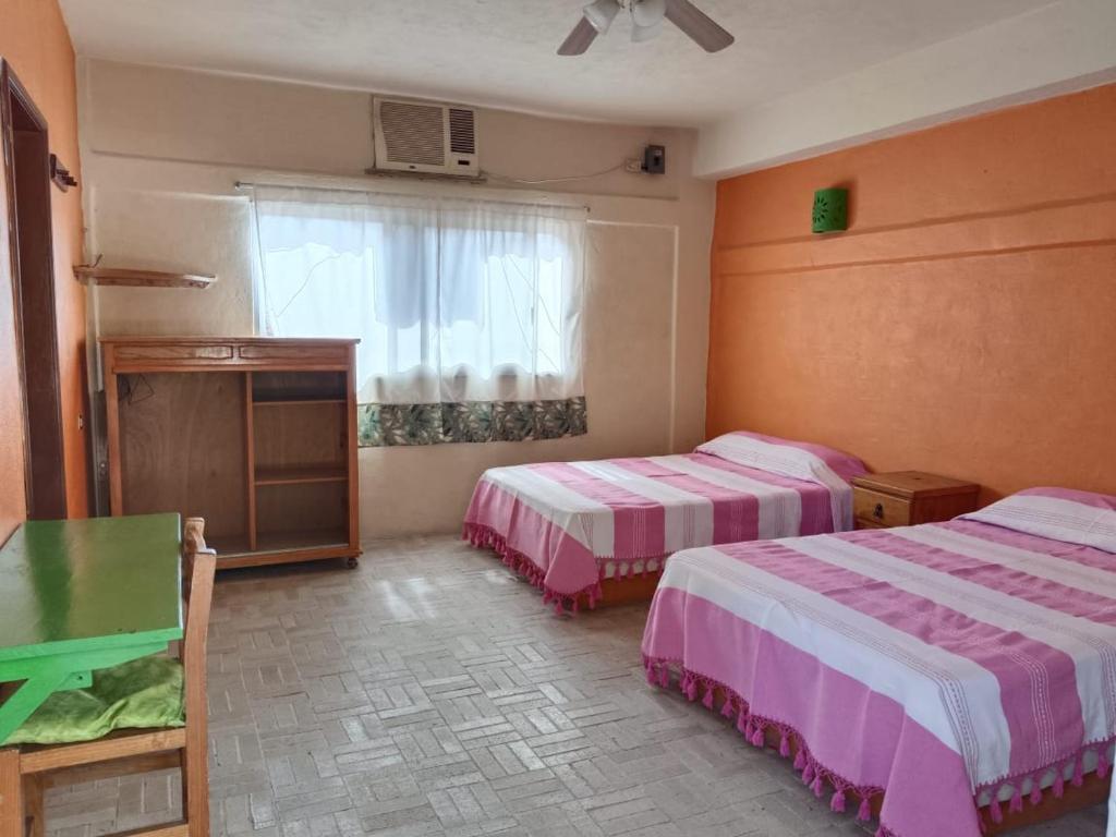 Cama o camas de una habitación en Hotel El Trebol