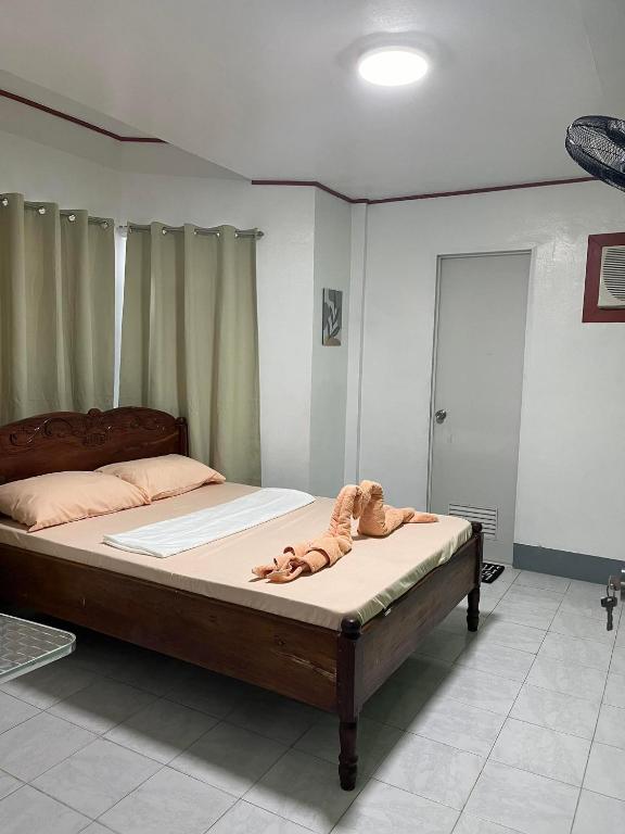 Postel nebo postele na pokoji v ubytování Em's Homestay