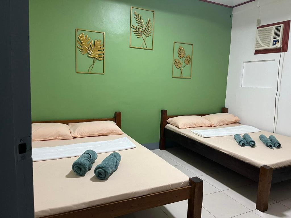 Postel nebo postele na pokoji v ubytování Em's Homestay