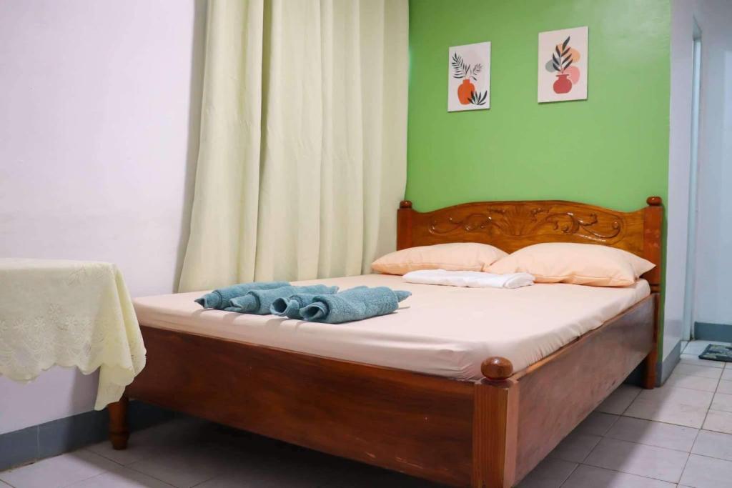 Postel nebo postele na pokoji v ubytování Em's Homestay