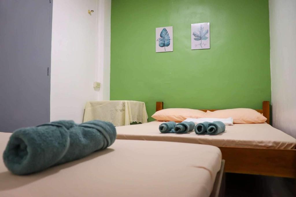 Postel nebo postele na pokoji v ubytování Em's Homestay