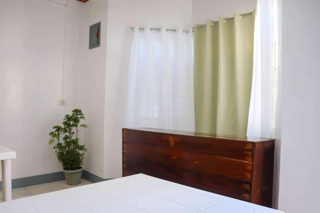 Postel nebo postele na pokoji v ubytování Em's Homestay