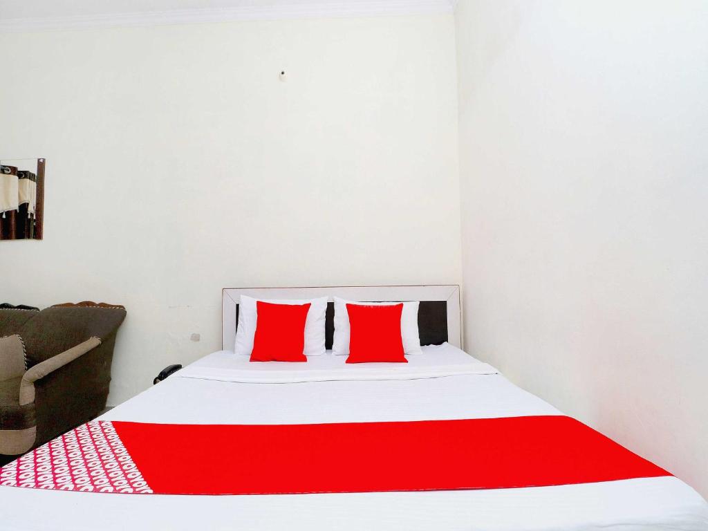 Postel nebo postele na pokoji v ubytování Hotel O Welcome Lounge