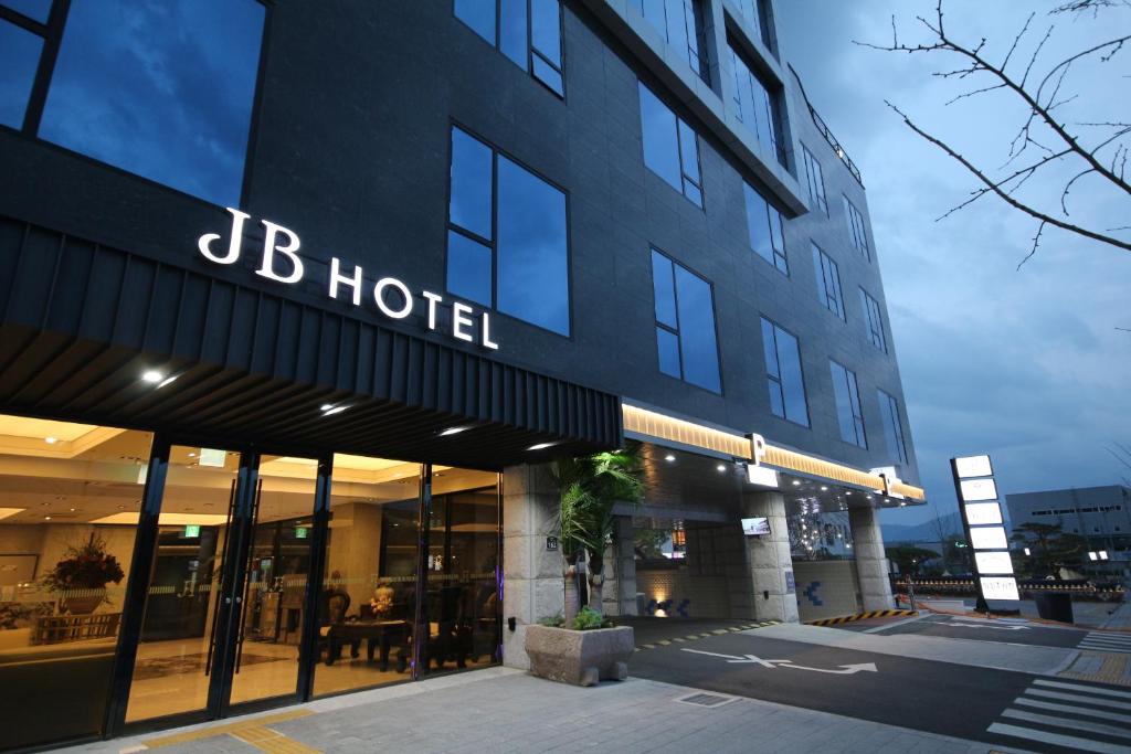 a hotel with a sign on the side of a building at JB Tourist Hotel in Daegu