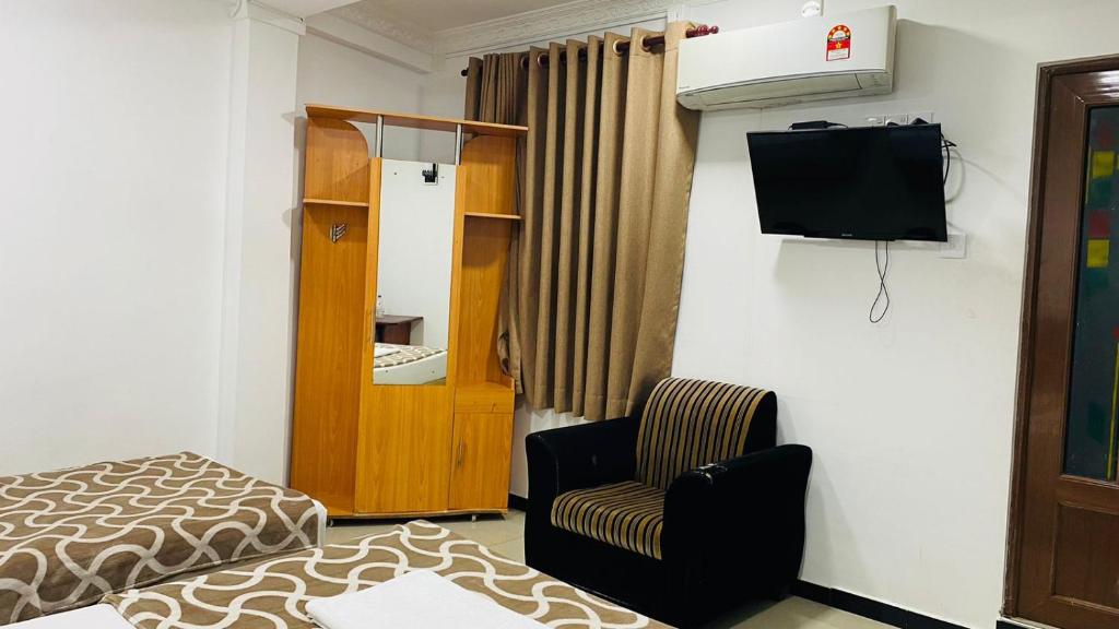 TV a/nebo společenská místnost v ubytování Saasha City Hotel