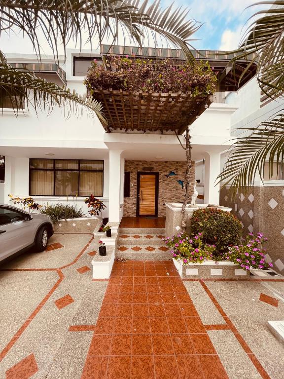 a house with a car parked in front of it at Casa en Punta Barandua in Punta Blanca