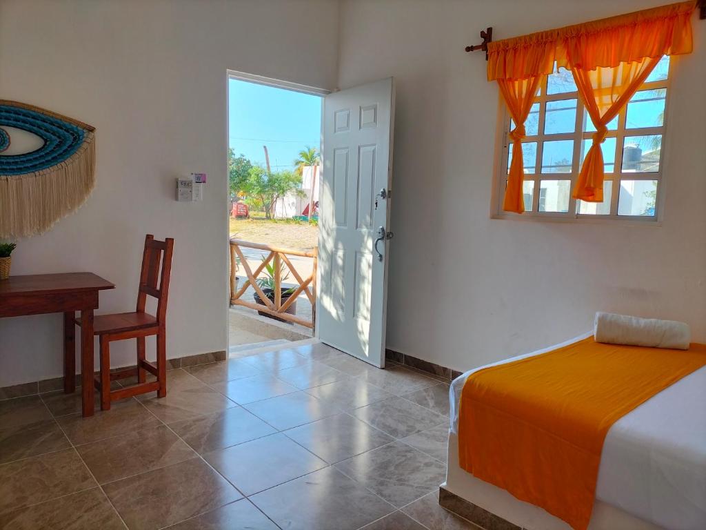 Postel nebo postele na pokoji v ubytování HOTEL LAS COLORADAS