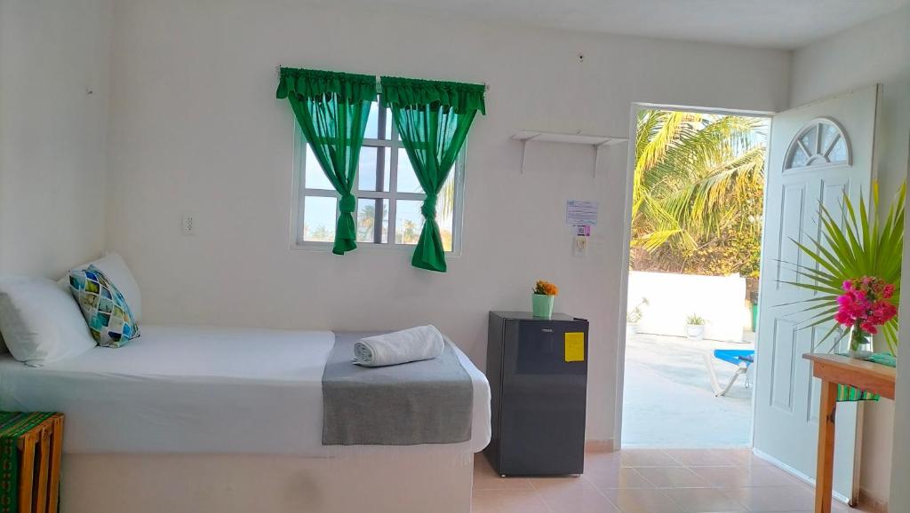 Postel nebo postele na pokoji v ubytování HOTEL LAS COLORADAS