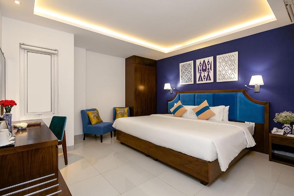 Postel nebo postele na pokoji v ubytování TGT BEACH HOTEL