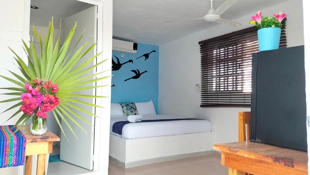 Postel nebo postele na pokoji v ubytování HOTEL LAS COLORADAS