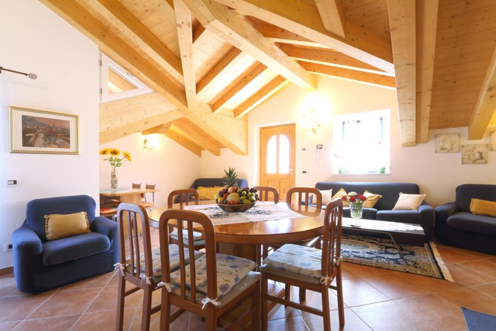 a living room with a table and chairs at Bella Vista in Canale San Bovo