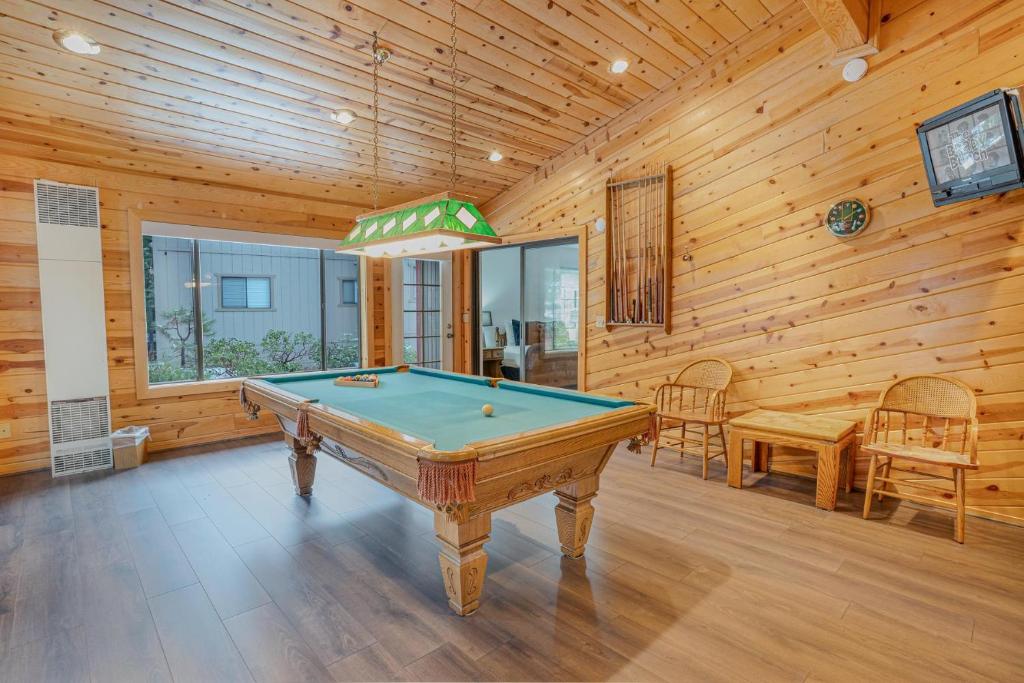 a pool table in a room with wooden walls at Kingswood Manor in Tahoe Vista