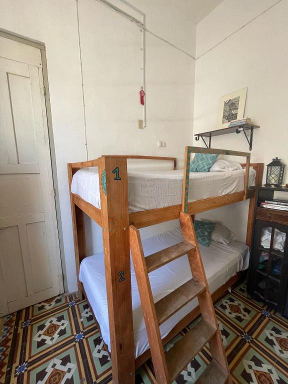 Postel nebo postele na pokoji v ubytování La Casa del Kéej Hostel