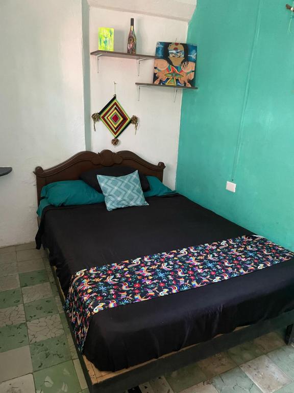 Postel nebo postele na pokoji v ubytování La Casa del Kéej Hostel