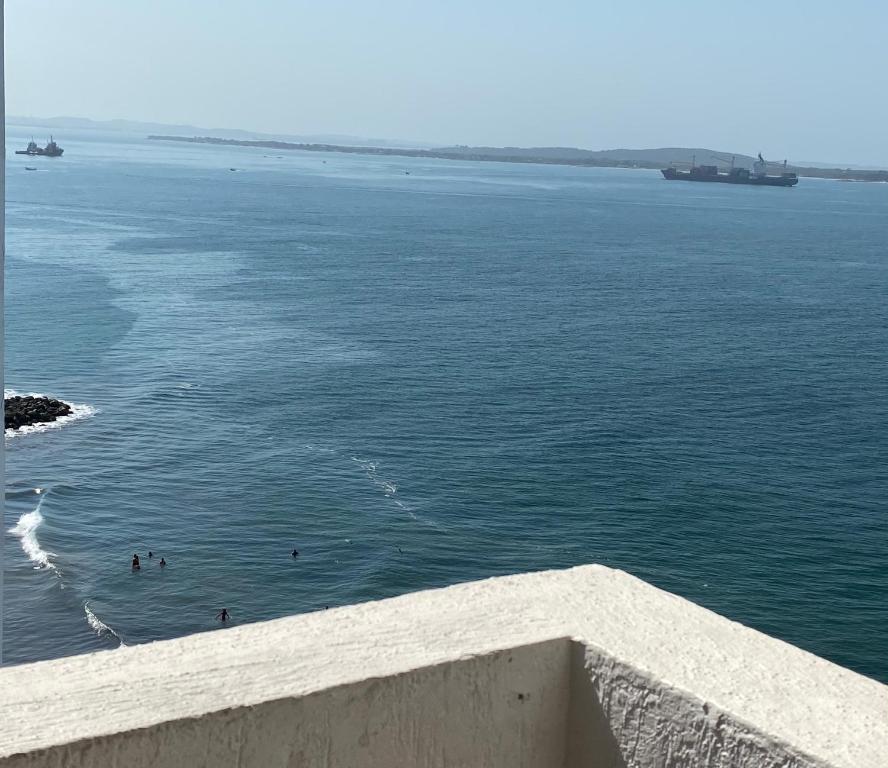 a view of the ocean with people in the water at Apartamento Amoblado en Cartagena de Indias in Cartagena de Indias