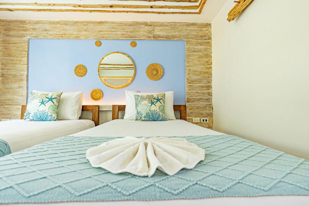 Postel nebo postele na pokoji v ubytování Arkbar Beach Club