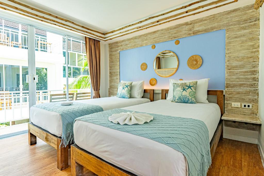 Postel nebo postele na pokoji v ubytování Arkbar Beach Club