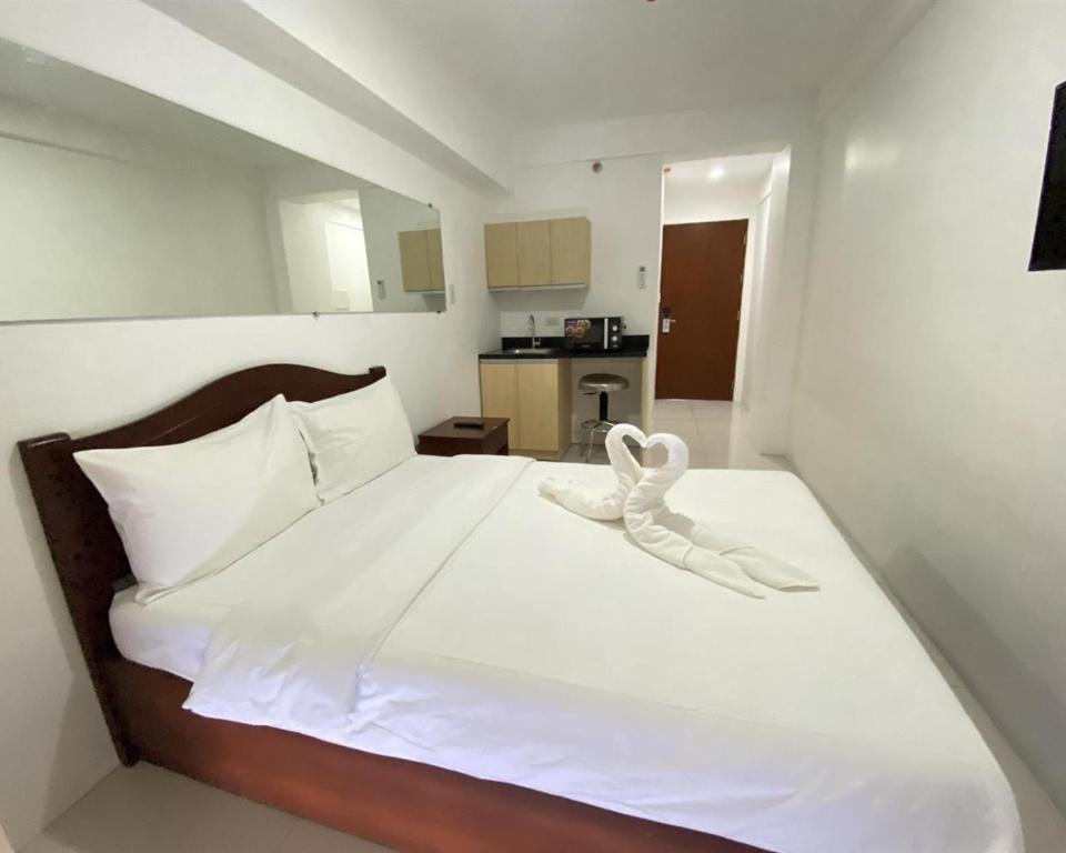 Postel nebo postele na pokoji v ubytování Dian SUITES 1