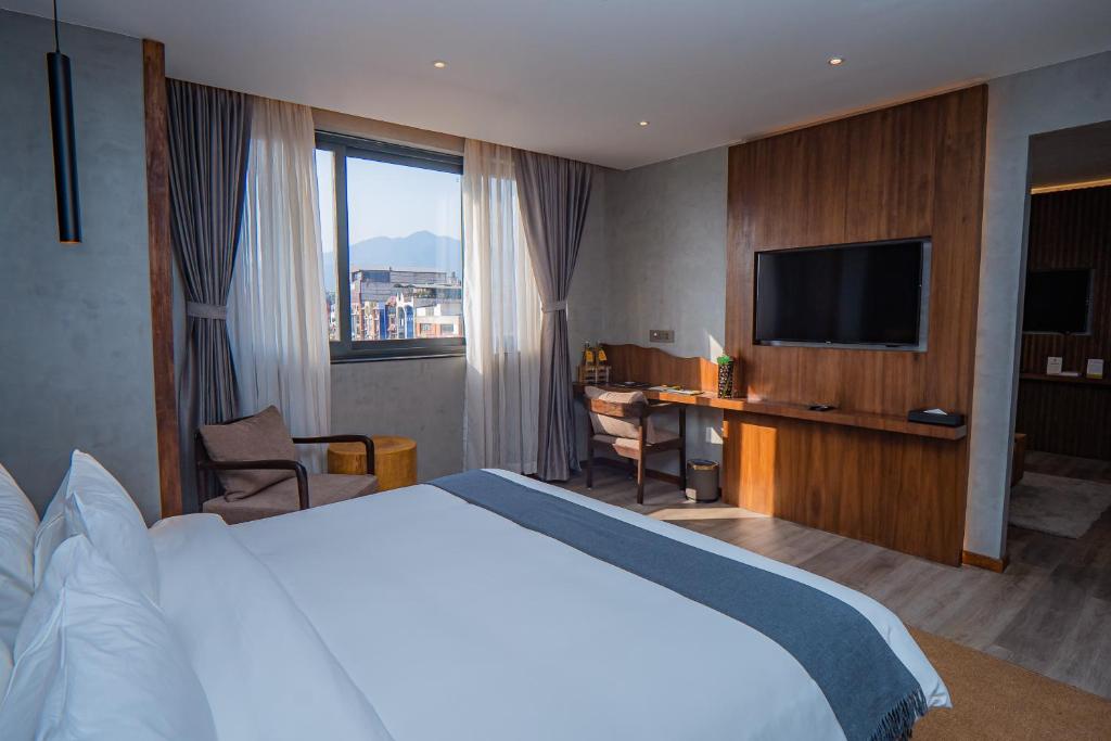 Postel nebo postele na pokoji v ubytování Hotel Barahi Kathmandu