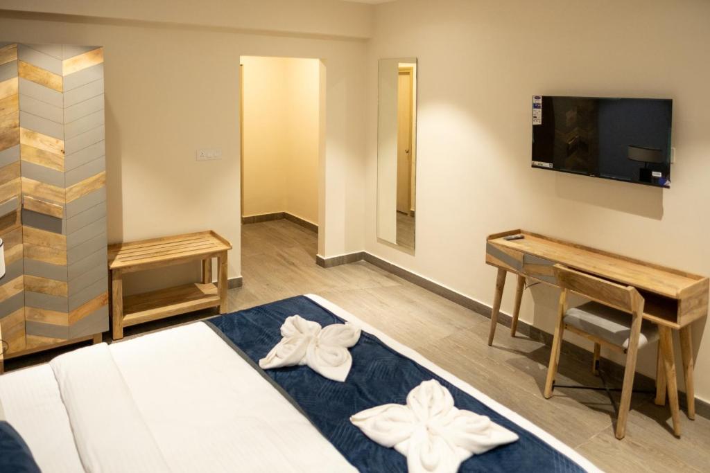 TV a/nebo společenská místnost v ubytování Palm Regal Resort