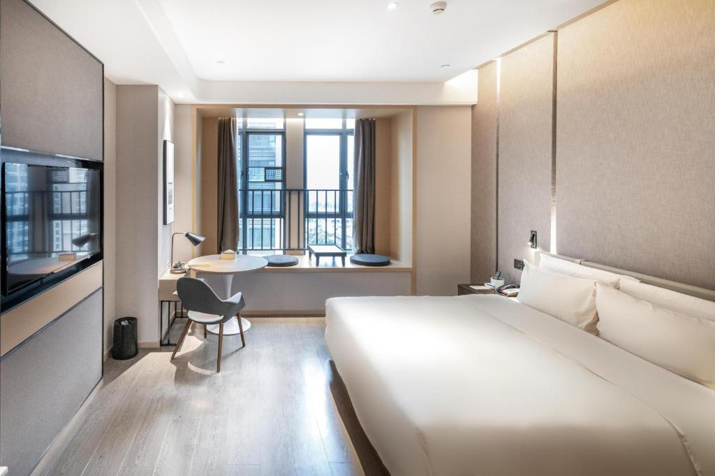 Postel nebo postele na pokoji v ubytování Atour Hotel Qingyuan Shunying Guangbai