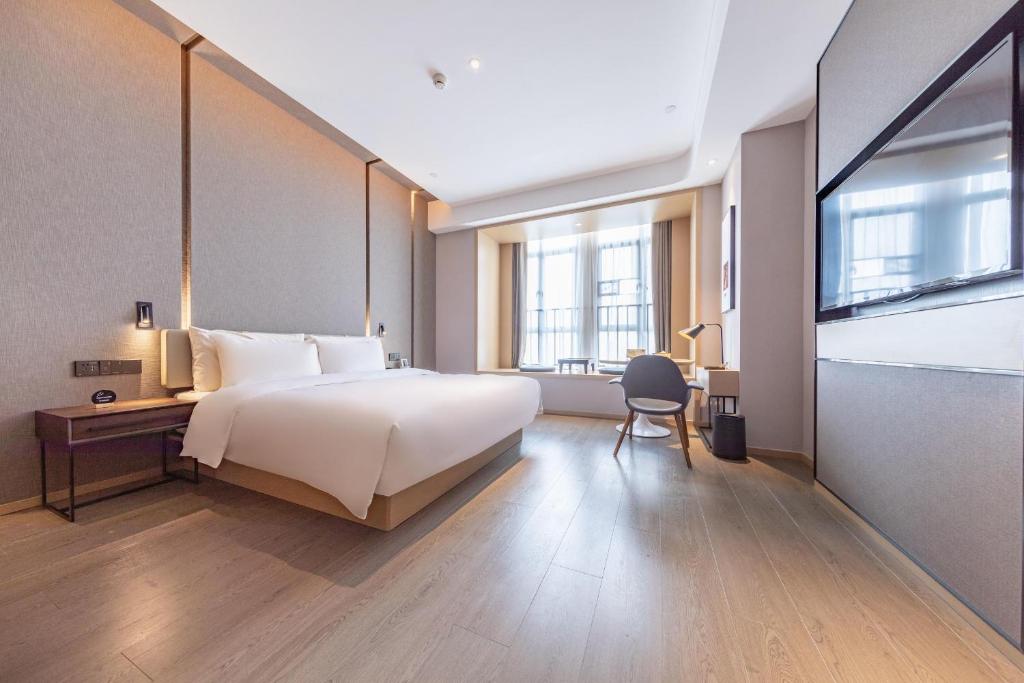 Postel nebo postele na pokoji v ubytování Atour Hotel Qingyuan Shunying Guangbai