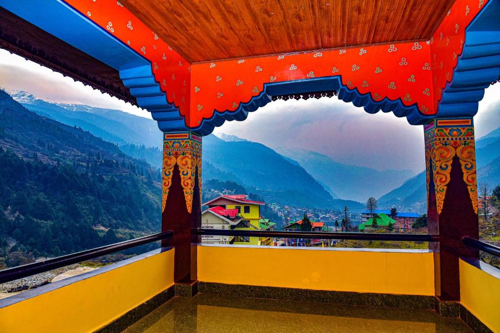 a view from a balcony with a view of mountains at Rufina Lachung Heritage in Lachung