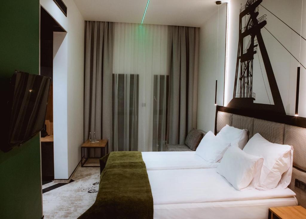 Postel nebo postele na pokoji v ubytování Hotel M23